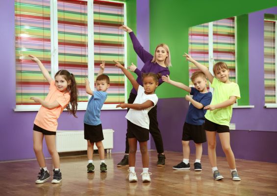 Dance teacher and children in choreography class